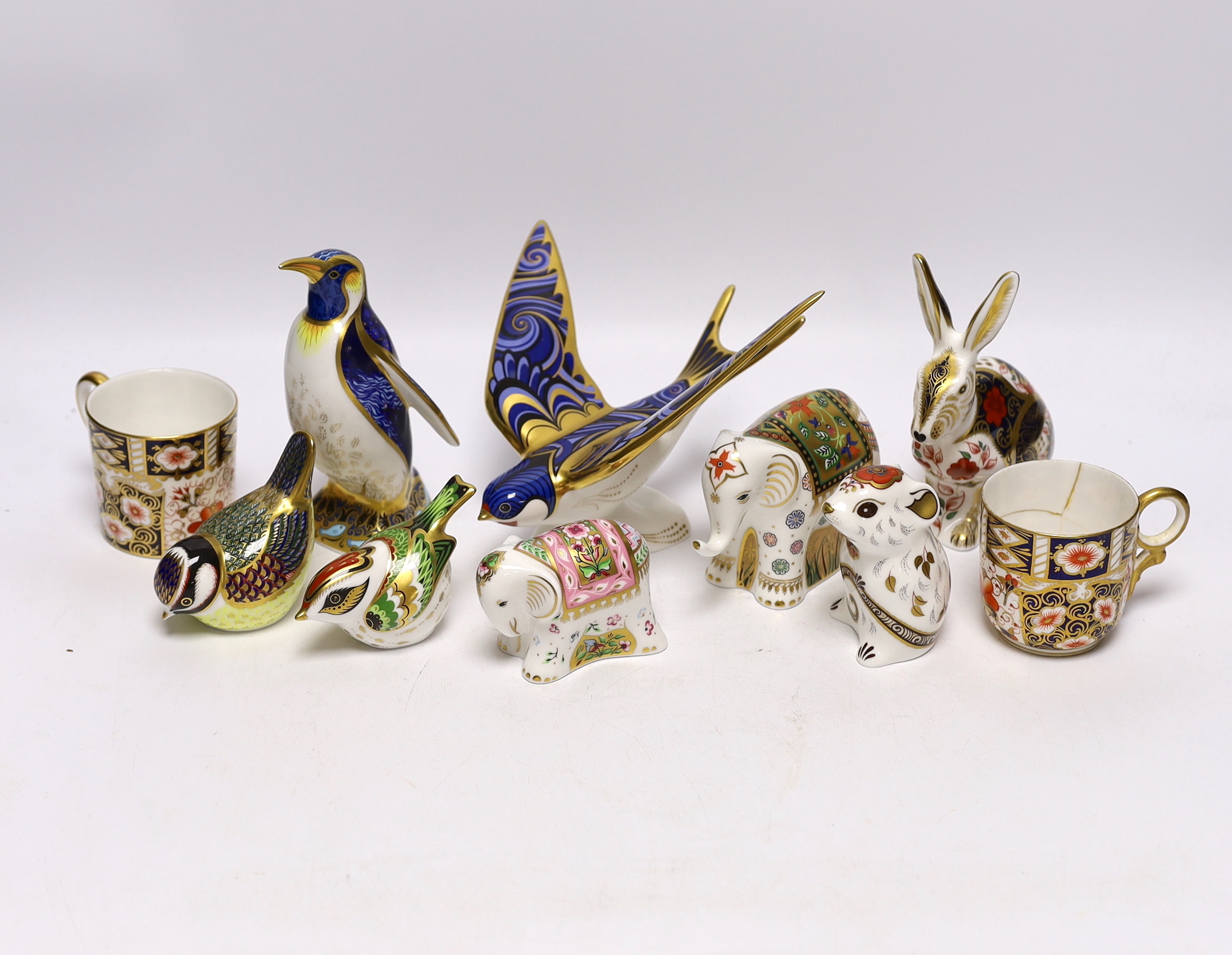 Eight Royal Crown Derby paperweight animal and bird models with boxes including Imari Hare and Emperor Penguin, largest 16cm wide